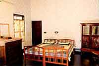 Bed Room at Tharavad Heritage Inn