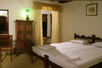 Bed Room at Tharavadu Heritage Hotel